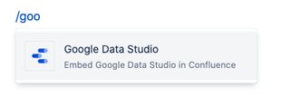 Confluence editor showing /goo typed to insert the Looker Studio macro